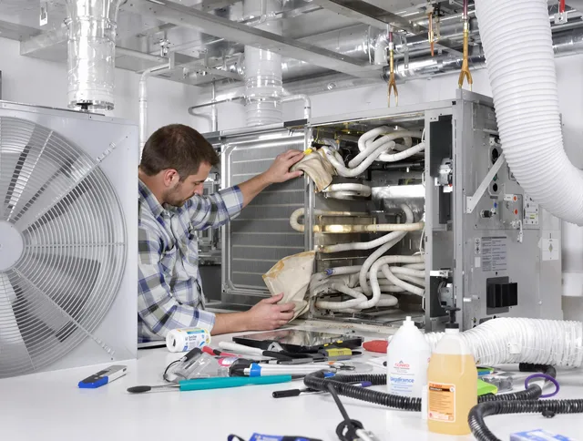 Barrington Air Duct Cleaning specialist performing precision AC coil cleaning in Barrington