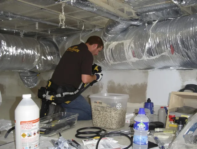 Barrington Air Duct Cleaning specialist performing professional mold removal from air ducts in Barrington