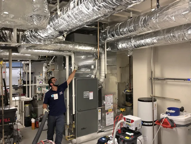 Barrington Air Duct Cleaning specialist performing thorough furnace duct cleaning in a Barrington residence