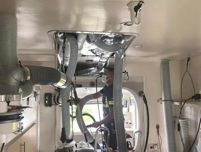 Barrington Air Duct Cleaning specialist performing precise mobile home duct cleaning in Barrington