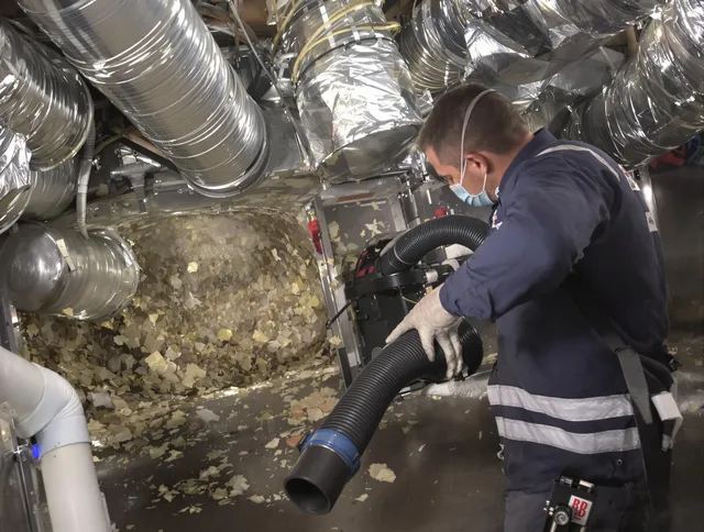 Barrington Air Duct Cleaning specialist operating negative pressure cleaning equipment for thorough duct maintenance in Barrington