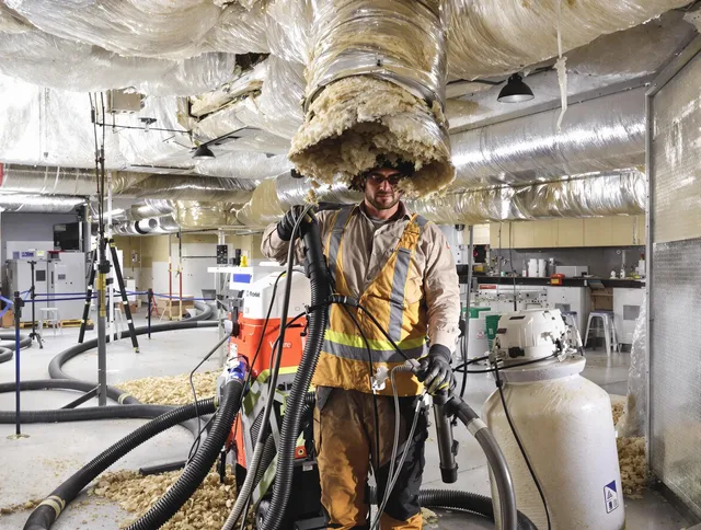 Professional vacuum insulation removal by Barrington Air Duct Cleaning expert in Barrington